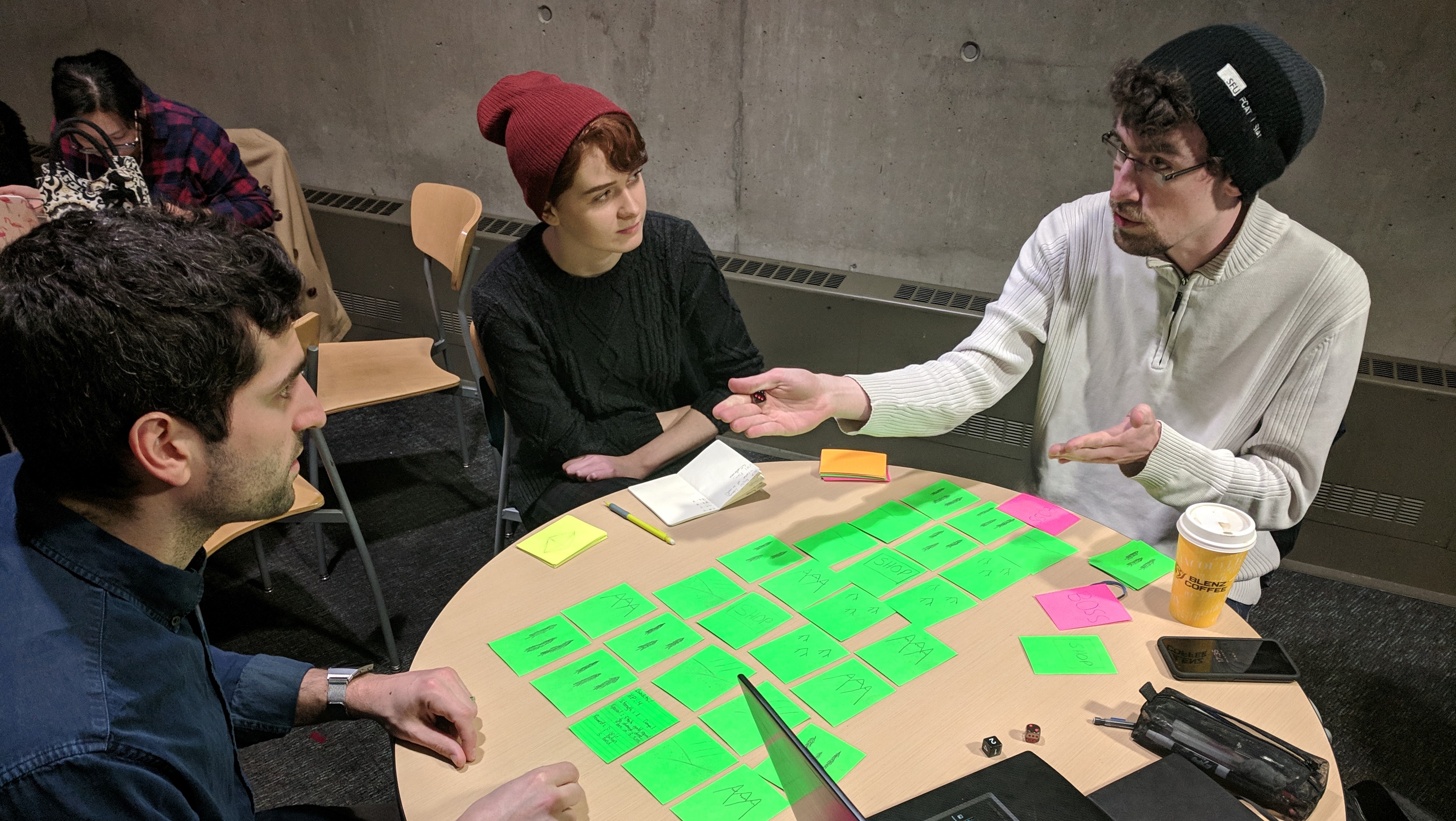 Testing a paper prototype of the overworld with a play tester